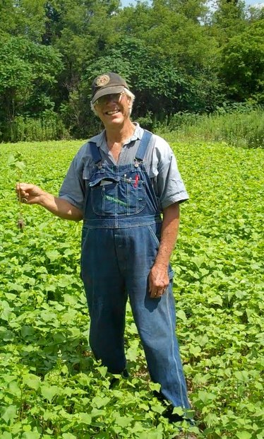 Mr. Raynor in a field of buckwheat.jpg